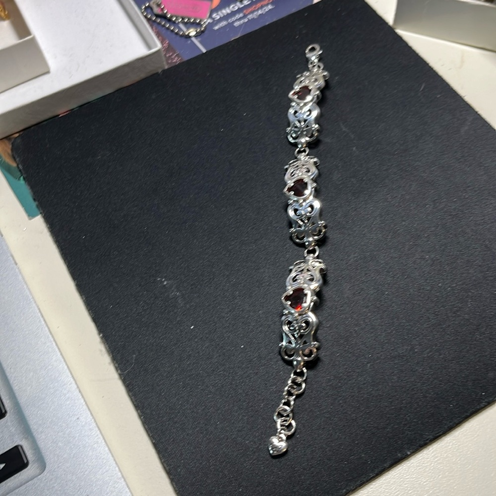 Brighton silver bracelet with red Ruby heart stones. 7.5”.